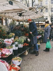 Customers shopping at a floral stand