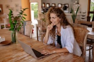 Woman talking with someone on laptop