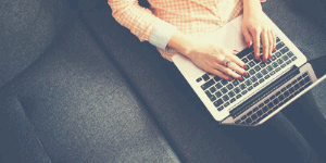 Woman blogging for business on a laptop