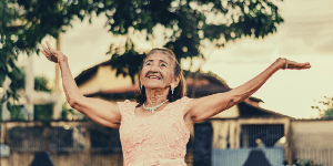 Happy elderly woman enjoying some time outside