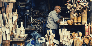 Man selling handmade goods at a flea market